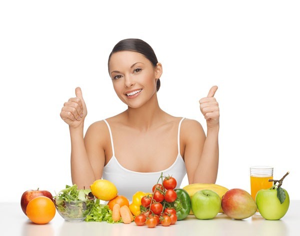 happy woman with fruits and vegetables