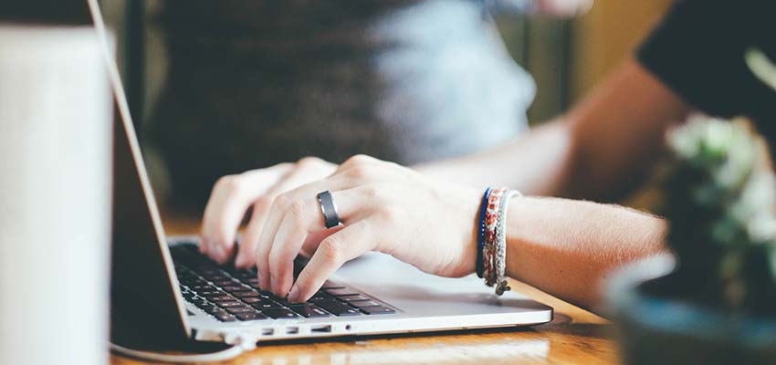 Person typing on a laptop