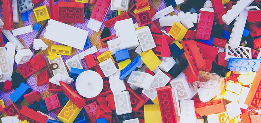 Toy building blocks scattered on a floor.