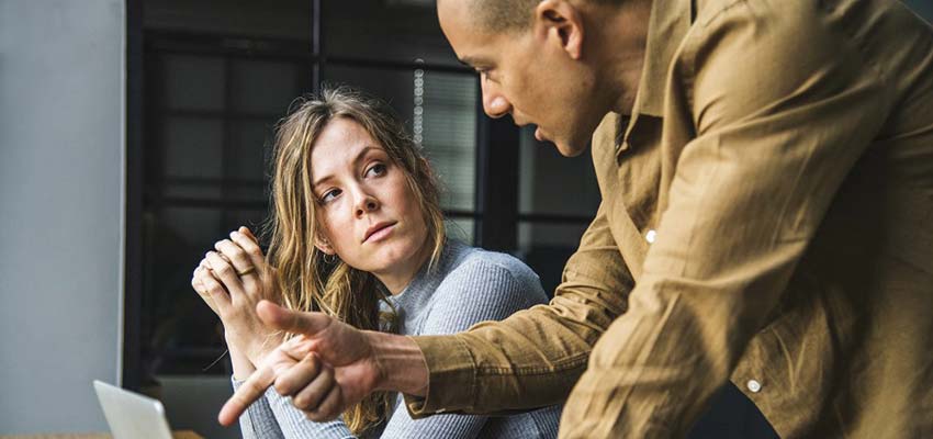 A woman and man having a discussion.