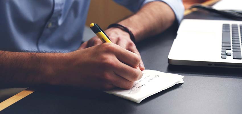 Man writing on paper