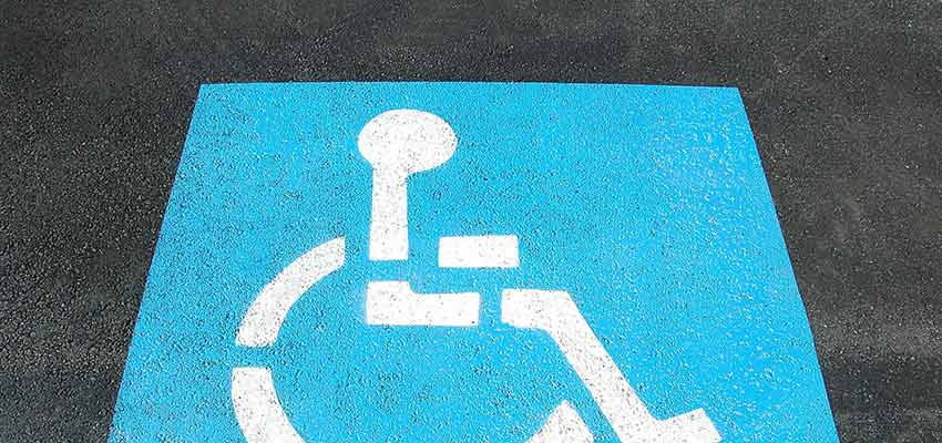A handicapped symbol on pavement.