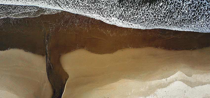 Waves crashing on a beach.