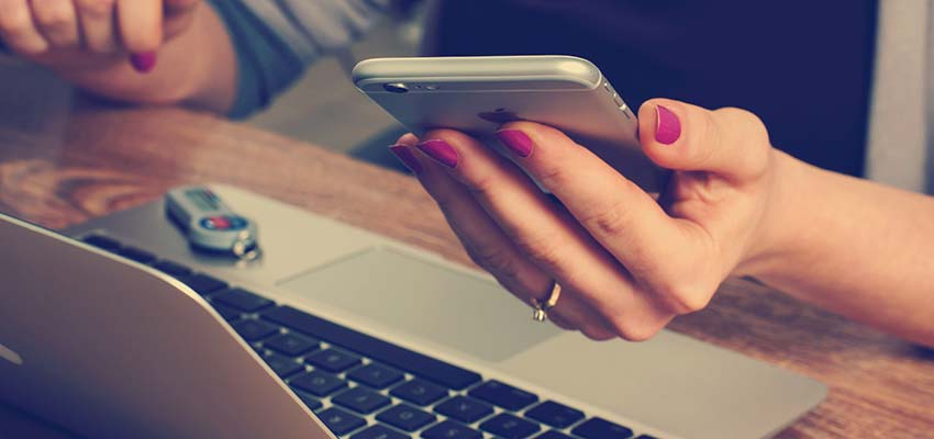 A woman using a mobile phone.