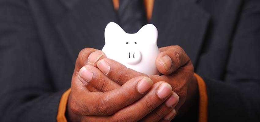 A man holding a piggy bank.