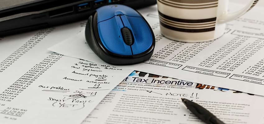 Financial documents on a desk.