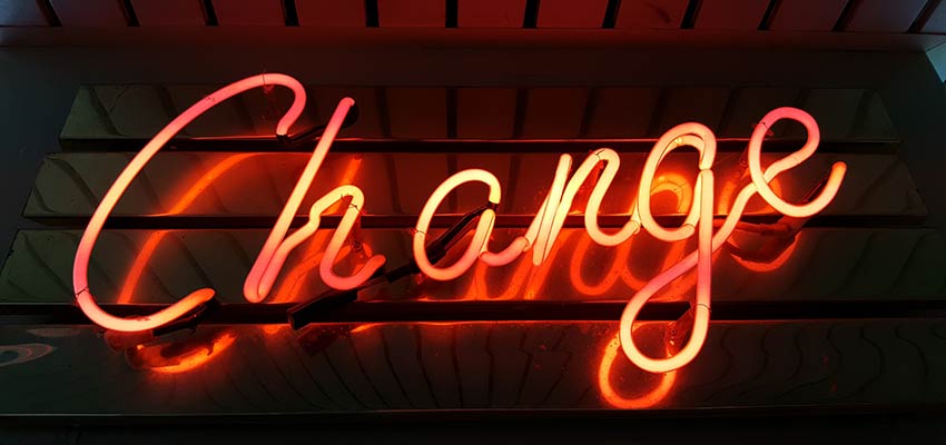 A neon sign that reads "Change".