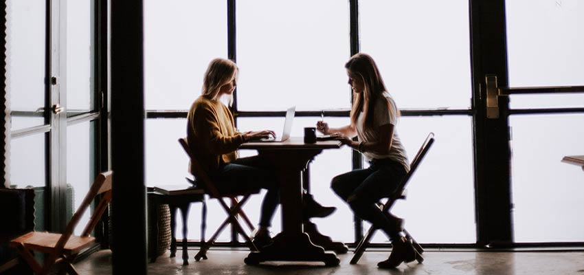 Women sitting at a table.