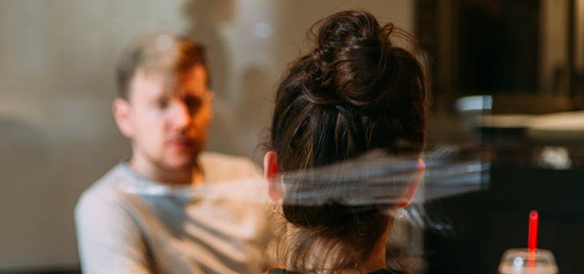 A man and woman having a discussion.