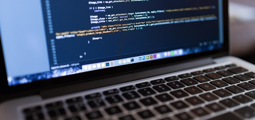 Hire A Web Designer - Coding laptop