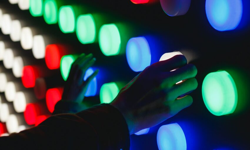 Neon style buttons touched by human hands